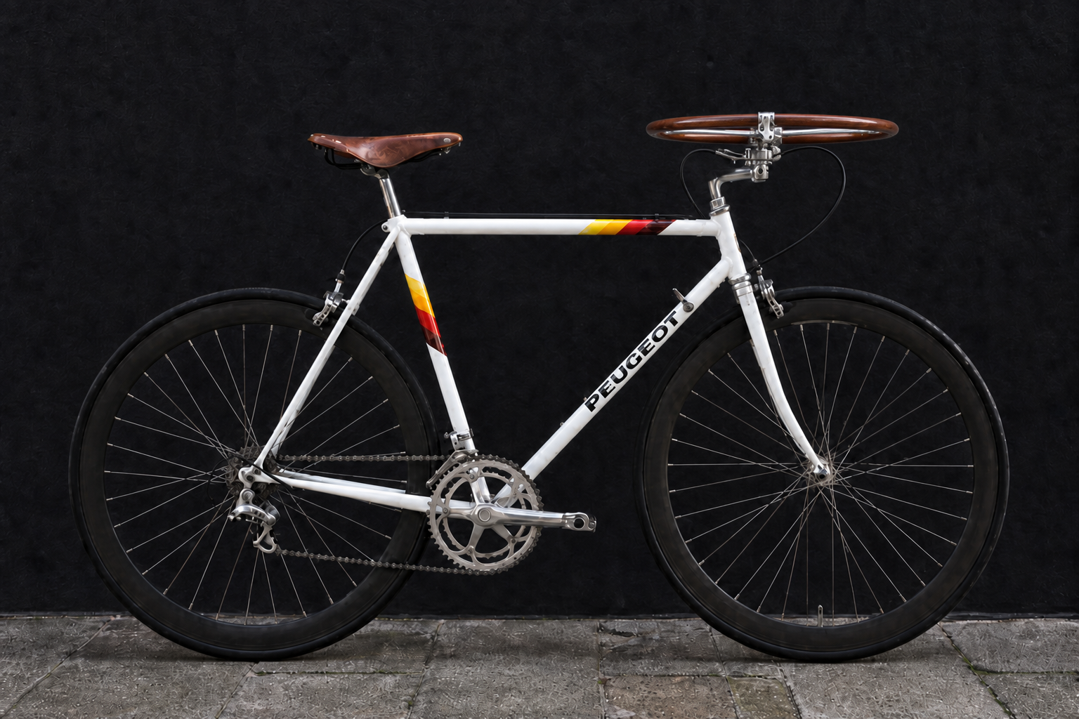 White Peugeot bicycle fitted with a horizontal wooden steering wheel and brake controls